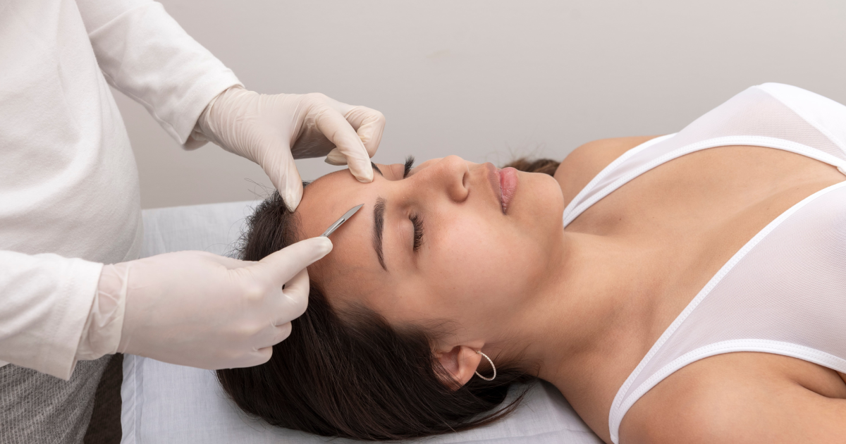 A woman receiving a dermaplaning facial treatment at a clinic in Goldsboro, NC