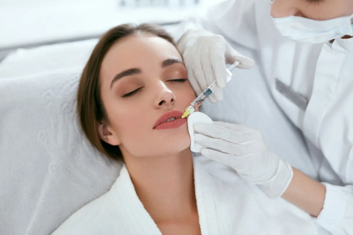 Woman receiving Lip Treatments from a professional at a clinic in Goldsboro, NC