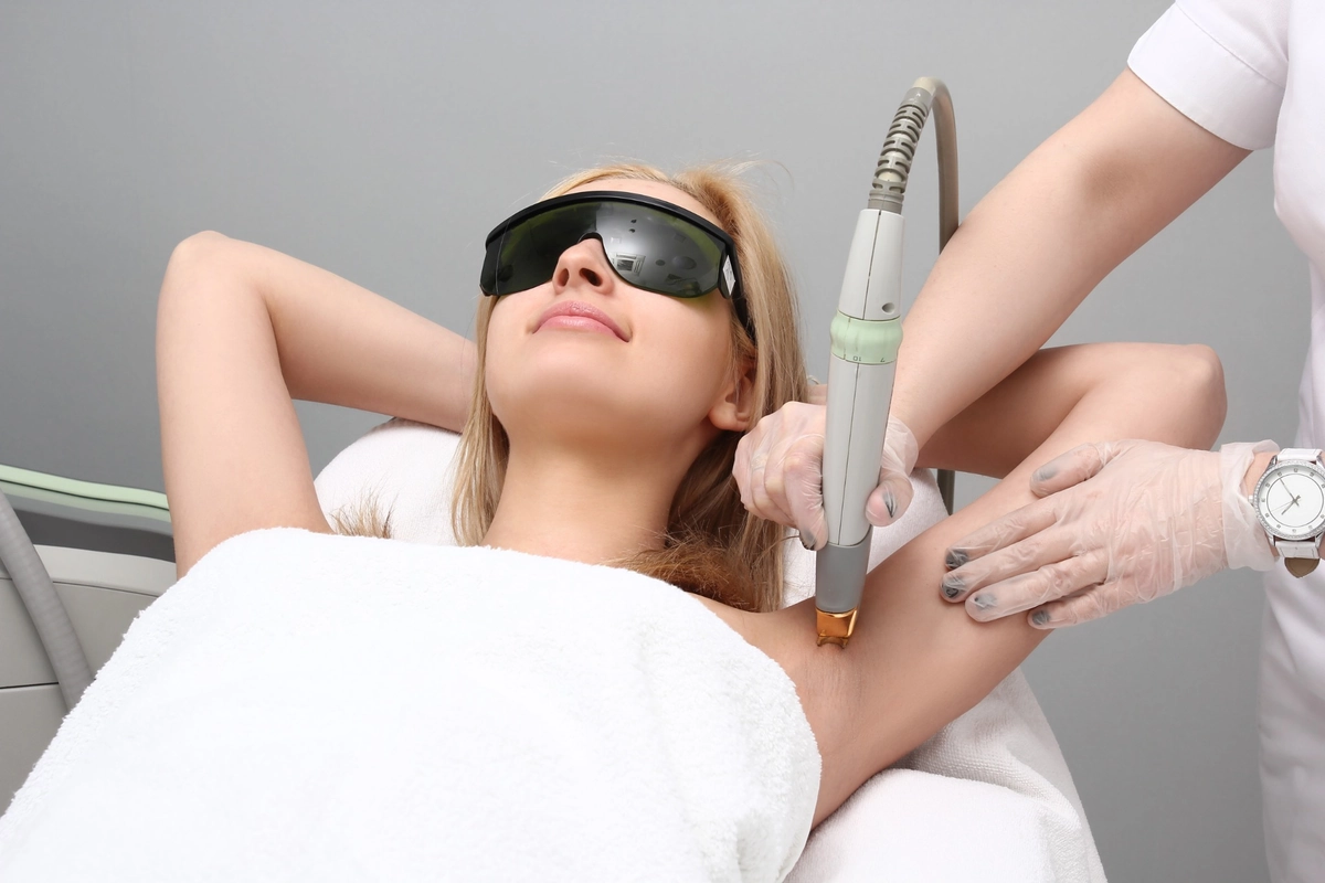 Woman Receiving Laser Hair Removal Treatment at Natural Beauty Aesthetics